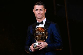 Cristiano Ronaldo with a Ballon d'Or trophy after winning five awards